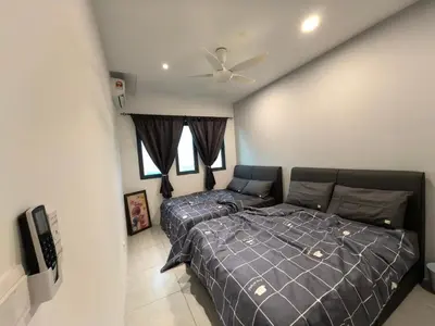a bedroom with a bed and a couch at Sky Suite Meritus Residence in Perai in Perai