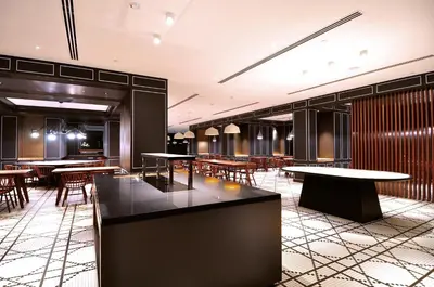 a restaurant with tables and chairs in a room at G Hotel Kelawai in George Town