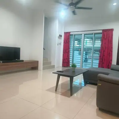 a living room with a couch and a table at Taiping Holiday Home 2 in Taiping