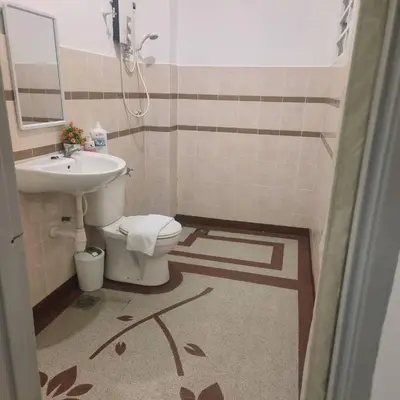 a bathroom with a toilet and a sink at Taiping Holiday Home 2 in Taiping