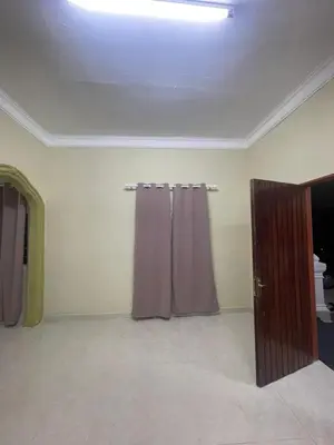 a room with two curtains and a door at Homestay Abah At in Baling