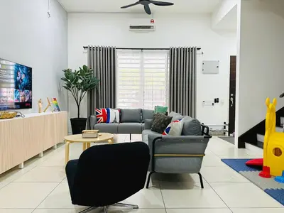a living room with a couch and a table at BM\u5927\u5c71\u811a Double Storey Terrace Autocity Alma Aeon Jusco Nearby in Bukit Mertajam
