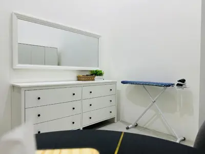 a bedroom with a dresser and a mirror at BM\u5927\u5c71\u811a Double Storey Terrace Autocity Alma Aeon Jusco Nearby in Bukit Mertajam