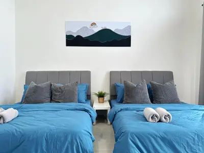two beds sitting next to each other in a bedroom at BM\u5927\u5c71\u811a Double Storey Terrace Autocity Alma Aeon Jusco Nearby in Bukit Mertajam
