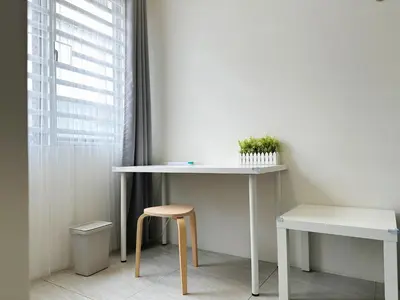 a white desk with a stool next to a window at BM\u5927\u5c71\u811a Double Storey Terrace Autocity Alma Aeon Jusco Nearby in Bukit Mertajam