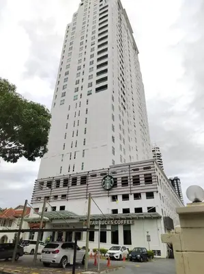 a tall white building with a clock on it at Exclusive Studio, 20th, 5pax, Gurney, Mansion One, Gleneagle Hospital in George Town