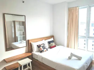 a bedroom with a bed with a mirror and a stool at Exclusive Studio, 20th, 5pax, Gurney, Mansion One, Gleneagle Hospital in George Town