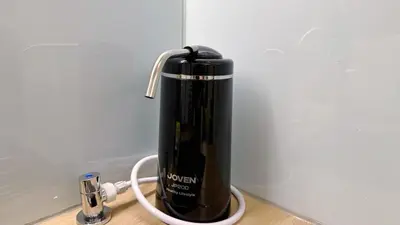 a black thermos is sitting on a counter at Noordin ClanJetties Komtar Heritage Studio - W in George Town
