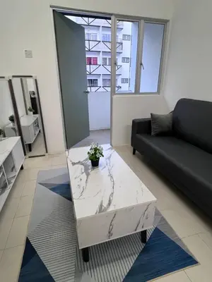 a living room with a couch and a coffee table at Ayaan Cozy Homestay Cameron Highland in Tanah Rata