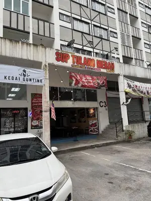 a white car parked in front of a building at Ayaan Cozy Homestay Cameron Highland in Tanah Rata