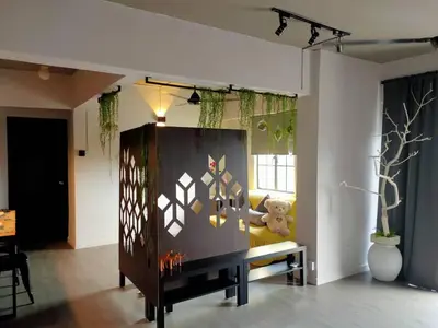 a living room with a couch and a table at Cozy 2-Bedroom Apartment in Air Itam, Perfect for Family & Friends Getaway in Ayer Itam