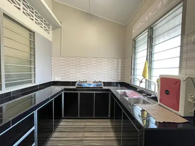 a bathroom with a glass counter and a sink at 3 rooms Town Homestay 1 mins to Town in Teluk Intan