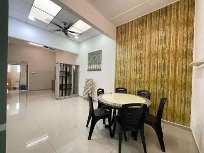 a dining room with a table and chairs at 3 rooms Town Homestay 1 mins to Town in Teluk Intan