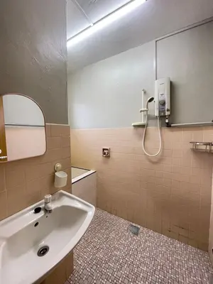 a bathroom with a sink and a mirror at 3 rooms Town Homestay 1 mins to Town in Teluk Intan
