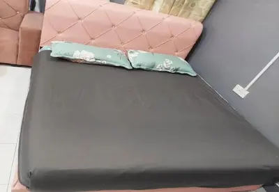two pillows sitting on top of a bed at Hotel Iskandar Perak in Seri Iskandar