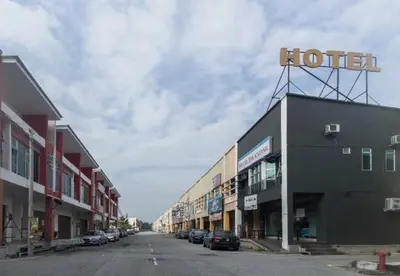 a street with a hotel sign on top of a building at Hotel Iskandar Perak in Seri Iskandar
