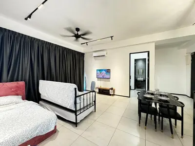 a bedroom with a bed and a dining room at b29 Condo In Georgetown Familystay 3BR-10PAX in Jelutong