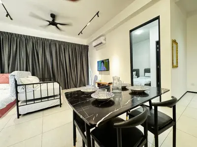 a living room with a dining room table and a bedroom at b29 Condo In Georgetown Familystay 3BR-10PAX in Jelutong