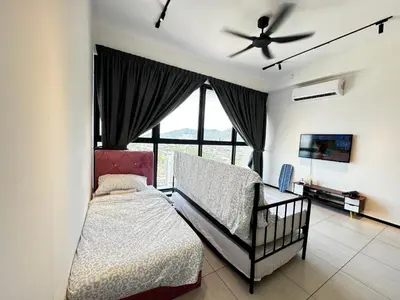 a bedroom with a crib and a ceiling fan at b29 Condo In Georgetown Familystay 3BR-10PAX in Jelutong