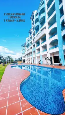 a swimming pool in front of a building at D'Marina 2 HOMESTAY LUMUT MANJUNG in Lumut