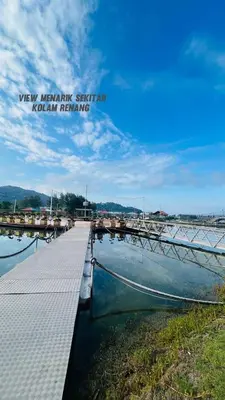 a dock with a boat in the water at D'Marina 2 HOMESTAY LUMUT MANJUNG in Lumut