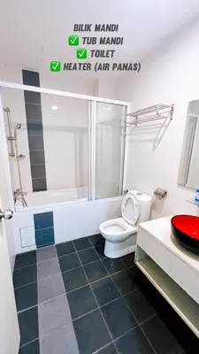 a bathroom with a toilet and a shower and a sink at D'Marina 2 HOMESTAY LUMUT MANJUNG in Lumut