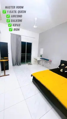 a bedroom with a yellow bed in a white room at SS MANJUNG HomeSTAY in Seri Manjung