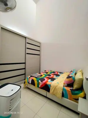 a bedroom with a bed and a trash can at Pa&Ma HomeStay Kulim II 3R2B fully aircond wifi netflix in Kulim