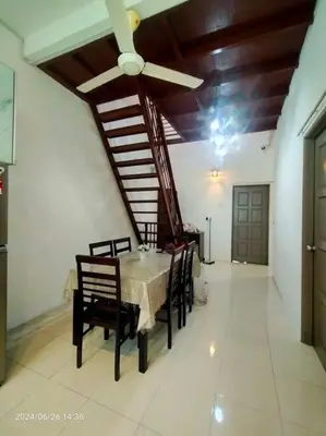 a dining room with a table and chairs and a ceiling fan at Pa&Ma HomeStay Kulim II 3R2B fully aircond wifi netflix in Kulim