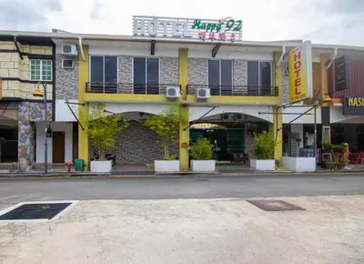 an empty street in front of a building at JQ Happy Lumut Hotel in Lumut