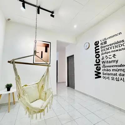 a hanging hammock in a room with a sign at MayiiVip Homestay - Menglembu in Ipoh