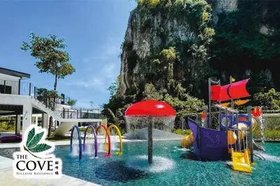 a pool with a water park with a water slide at Ipoh Tambun Waterpark Apartment The Cove Hillside in Ipoh