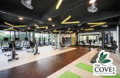 a gym with treadmills and exercise equipment in it at Ipoh Tambun Waterpark Apartment The Cove Hillside in Ipoh