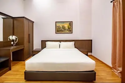 a bedroom with a large white bed in a room at 16celsius at Kea Farm Brinchang in Brinchang