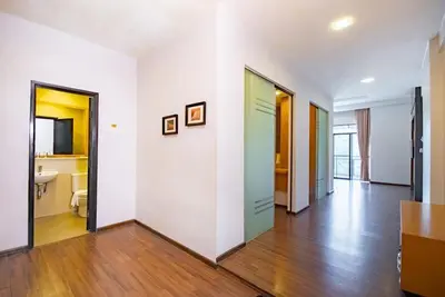 an empty room with white walls and wooden floors at 16celsius at Kea Farm Brinchang in Brinchang