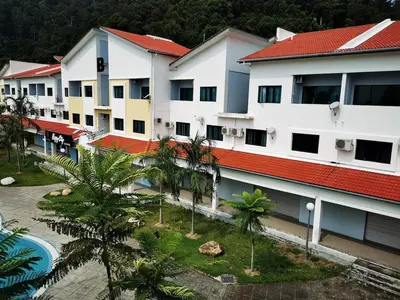an aerial view of a building with palm trees at 5 Lot 10 Pangkor Leisure Beach Studio in Pangkor