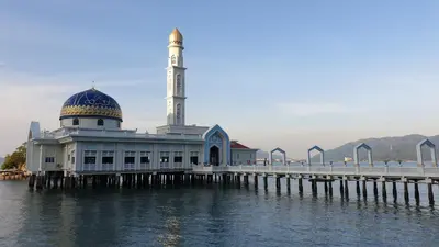 a mosque on the water next to a pier at 5 Lot 10 Pangkor Leisure Beach Studio in Pangkor