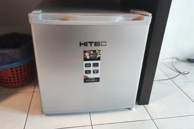 a white litter bin sitting on a floor at 5 Lot 10 Pangkor Leisure Beach Studio in Pangkor