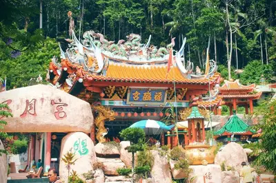 a building with a bunch of statues on top of it at C 23 Lot 10 Pangkor Leisure Beach Studio in Pangkor
