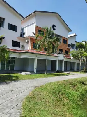 a large building with palm trees in front of it at C 23 Lot 10 Pangkor Leisure Beach Studio in Pangkor