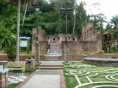 a stone building with a maze on the grass at C 23 Lot 10 Pangkor Leisure Beach Studio in Pangkor