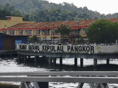 a sign on a bridge over a body of water at 39 Lot 10 Pangkor Leisure Beach Studio in Pangkor