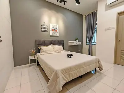 a bedroom with a large bed in a room at 20-24Paxx Near Sunway Lst World wPool Tab Karaok in Ipoh