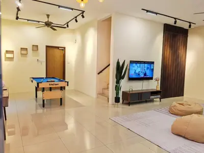 a living room with a pool table and a flat screen tv at 20-24Paxx Near Sunway Lst World wPool Tab Karaok in Ipoh