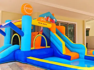 a play room with an inflatable slide and a bounce house at 20-24Paxx Near Sunway Lst World wPool Tab Karaok in Ipoh