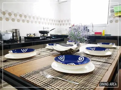 a kitchen with blue and white plates on a counter at 11pax5br Modern 5mins Ipoh Town wPoolTable in Ipoh