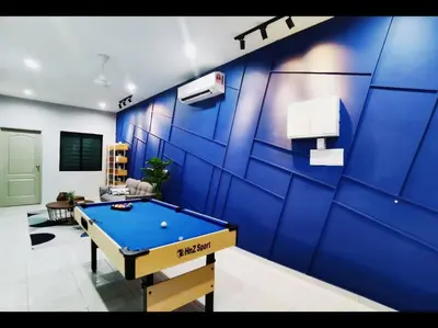 a blue wall with a pool table in a room at 11pax5br Modern 5mins Ipoh Town wPoolTable in Ipoh