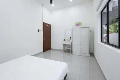 a white bedroom with a bed and a desk at Dream - Autumn at Pinji Ipoh Town in Ipoh