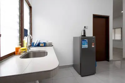 a kitchen with a sink and a refrigerator at Dream - Autumn at Pinji Ipoh Town in Ipoh