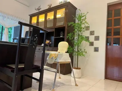 a room with a desk and a chair and a cabinet at C&C Villa Pool Ipoh in Ipoh